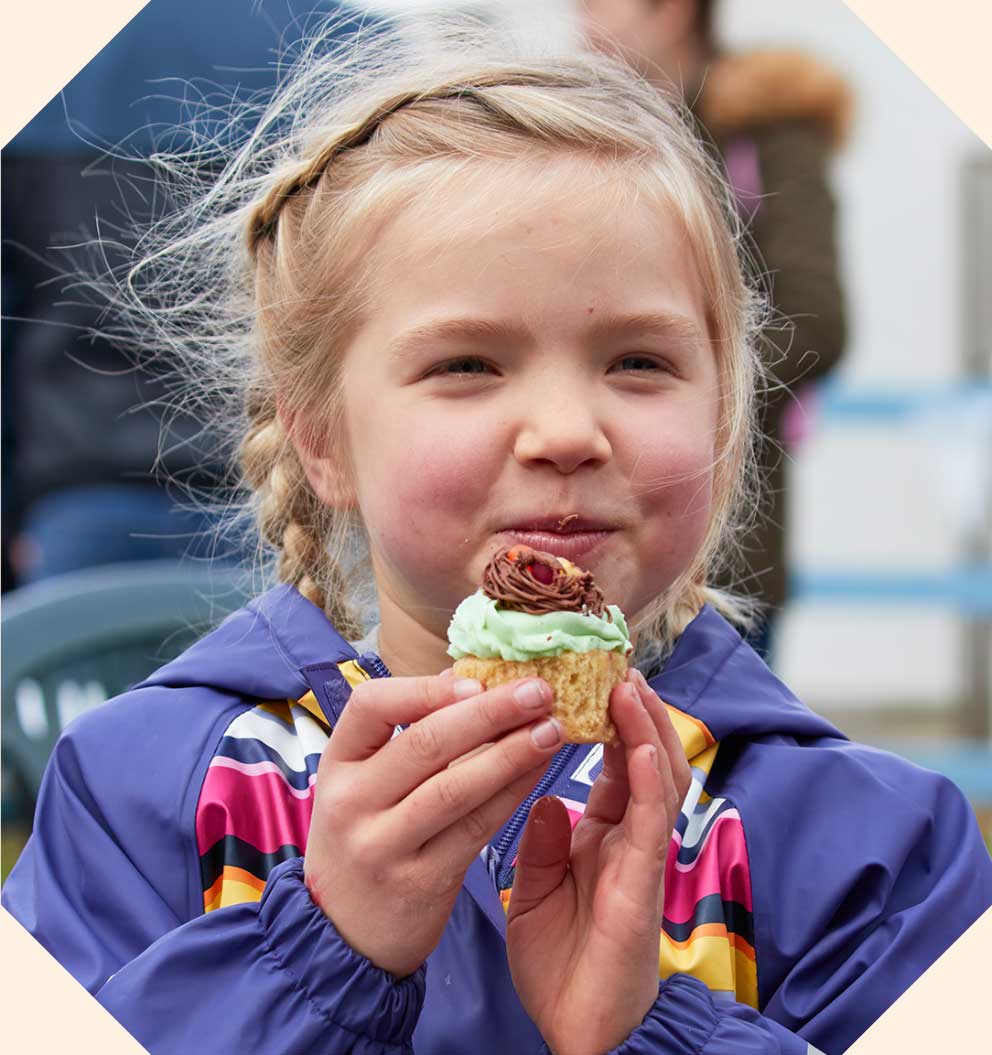 A child eating a cupcake.