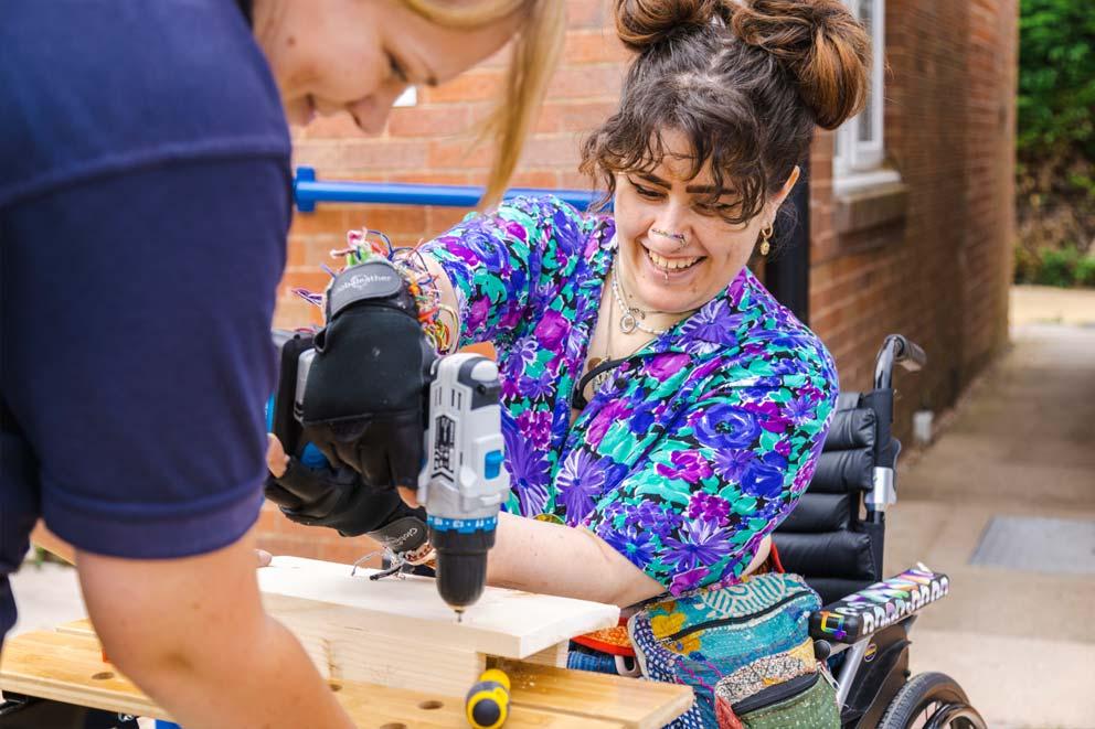 RSPCA staff and clients building bird nesting boxes in the wood workshop at Birmingham Newbrook Farmhouse Education Centre.