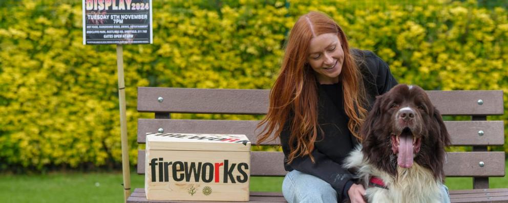 woman and dog on bench