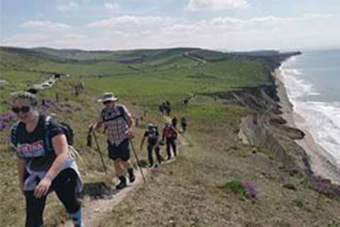 Fundraisers walking along the Isle of Wight coastal path for charity.