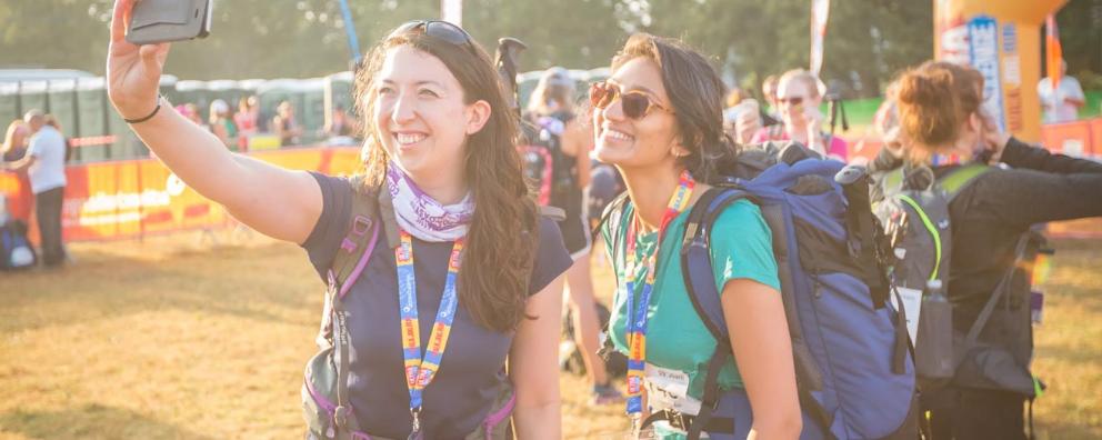 Two women taking a selfie before embarking on the Kent 50 Ultra Challenge trekking event.