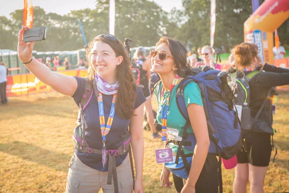 Two women taking a selfie before embarking on the Kent 50 Ultra Challenge trekking event.